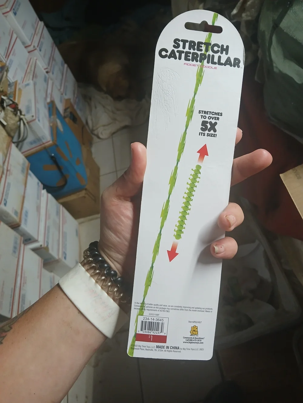 a pink stretchy caterpillar fidget toy with bumpy textures, made by Big Time Toy
